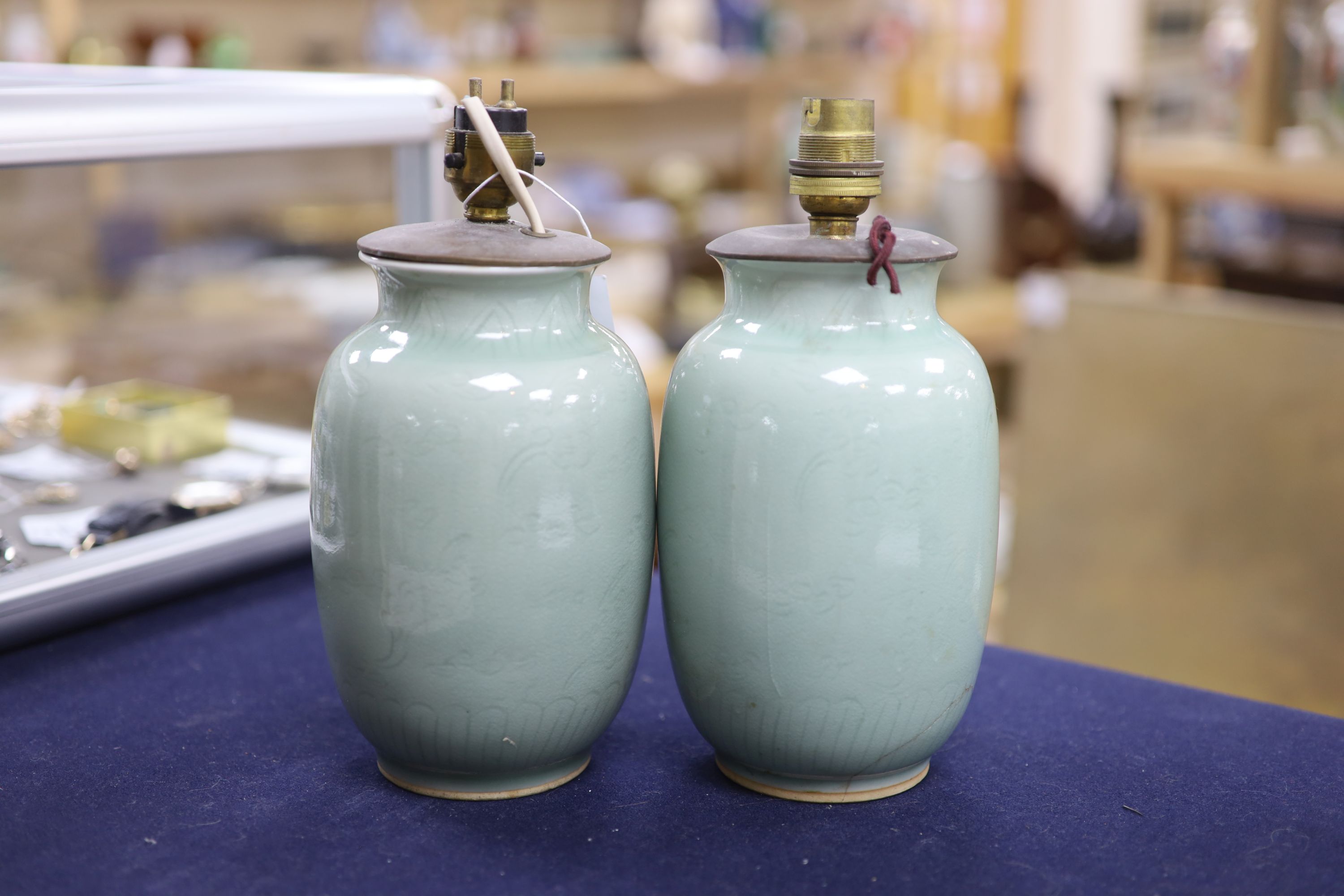 A pair of Chinese celadon vases, now as lamps, Yongzheng mark to base but later, height 19cm excl. electrical fittings